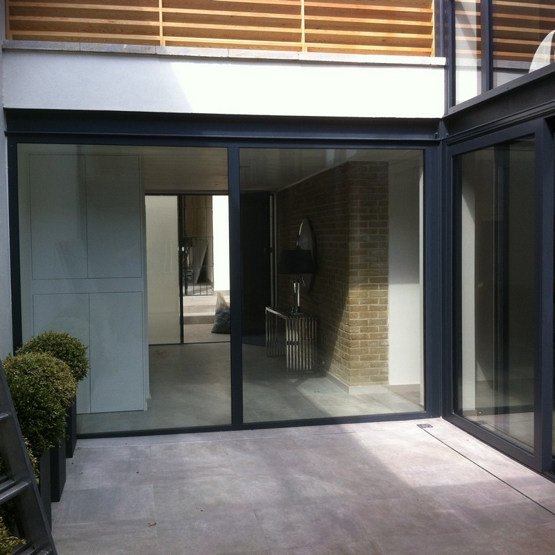 Floor-to-ceiling sliding doors opening to courtyard in Moorgate