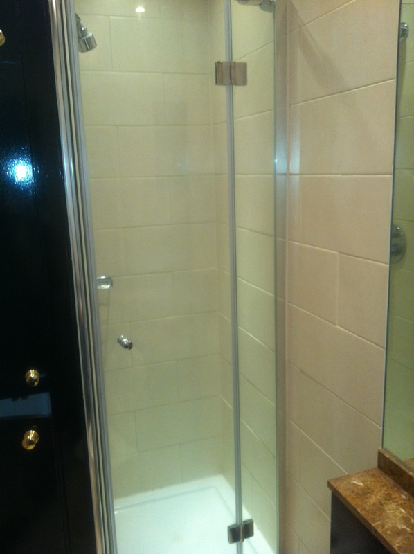 Frameless glass shower enclosure with chrome fittings in Moorgate