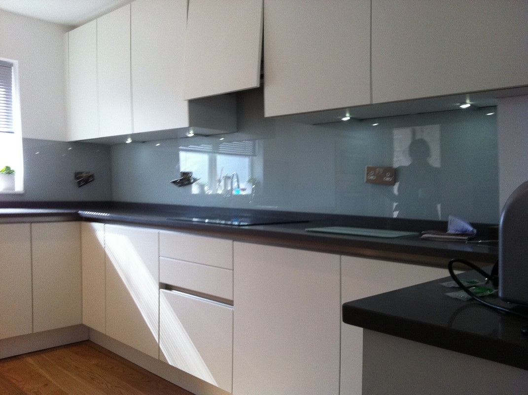 Grey glass kitchen splashback with LED lighting in Moorgate