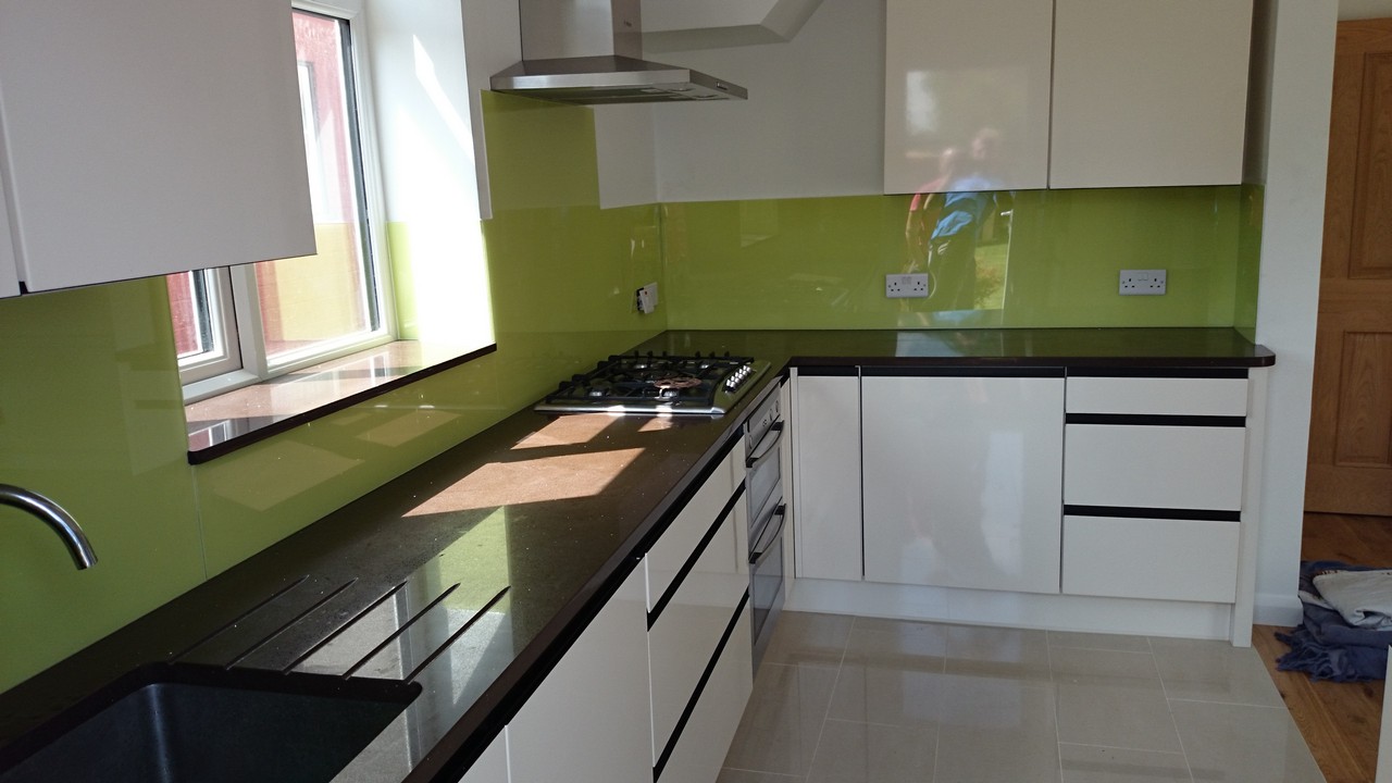 Lime green glass kitchen splashback installed by Moorgate glaziers