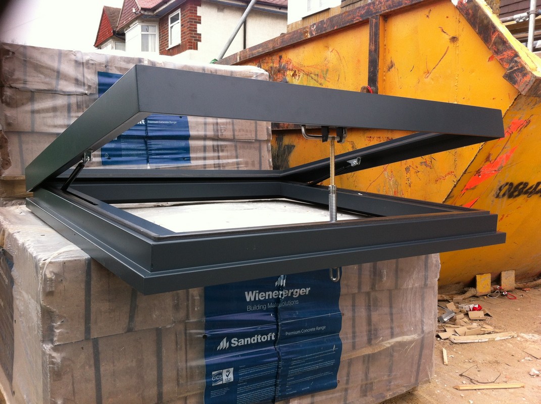 Opening flat roof skylight in anthracite grey installed in Moorgate