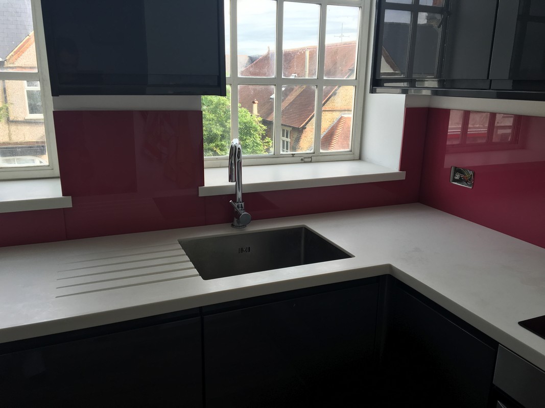 Deep plum coloured glass splashback in modern Moorgate kitchen