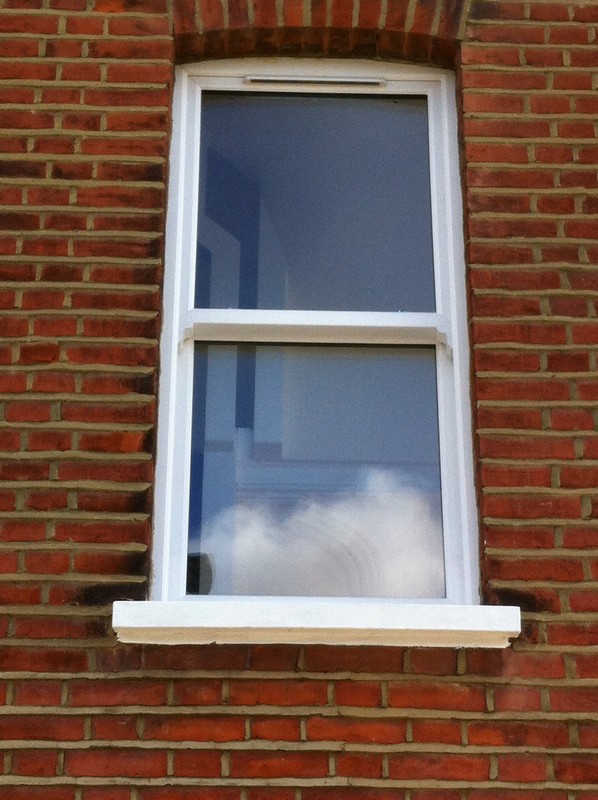 uPVC sash window on Victorian red brick house in Moorgate
